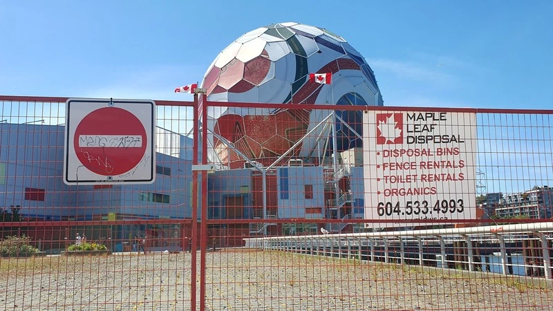 Another iconic view of the 2026 FiFA world cup - a shitty fence backdropped by Science World