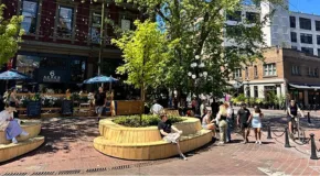 People sitting outside in Gastown on a sunny day